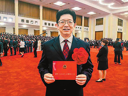 古利明赴京接受表彰。(古利明提供)